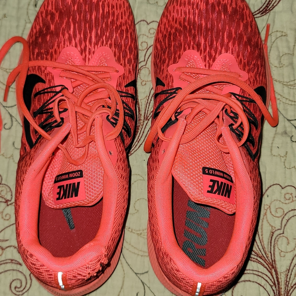 Orange Nike running shoes size 9.5